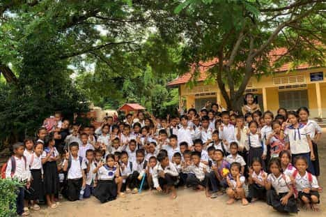 cambodian children sitting at a table