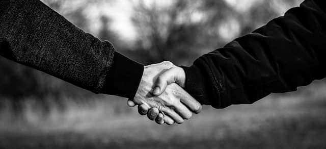 A black and white photo of a handshake A black and white photo of a handshake